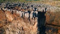 Drone rough stony rocks under summer sunlight. Dangerous cliff rugger stones.