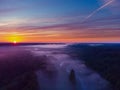 Drone\'s Eye View: Serene Sunrise Over Misty River and Woodland Landscape