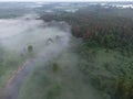 Drone\'s Eye View: Serene Sunrise Over Misty River and Woodland Landscape