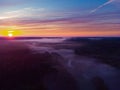 Drone\'s Eye View: Serene Sunrise Over Misty River and Woodland Landscape