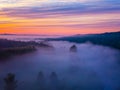 Drone\'s Eye View: Serene Sunrise Over Misty River and Woodland Landscape