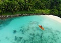 Unrecognizable Woman Canoeing in a Tropical Exotic Destination. Aerial Perspective of an Unrecognizable Tourist