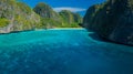 Drone`s view of Maya Bay, Phi Phi Island, with blue sea and blue sky overlooking clear water