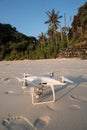 Drone on sandy beach over tropical island background Royalty Free Stock Photo