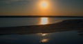 Drone sea beach at romantic golden sunset. Small sea waves splashing sand beach