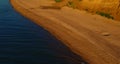 Drone seaside view with peaceful white seashore. Sunny warm day on sandy beach. Royalty Free Stock Photo