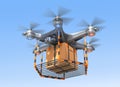 Drone flying with cardboard box in sky. Royalty Free Stock Photo