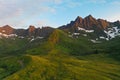 Drone shot above mountain peaks during sunset in Northern Norway
