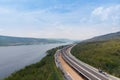 Drone shot aerial view landscape of under construction motorway tolls near big natural river Royalty Free Stock Photo