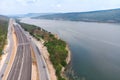 Drone shot aerial view landscape of under construction motorway tolls near big natural river Royalty Free Stock Photo