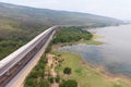 Drone shot aerial view landscape of under construction motorway tolls near big natural river Royalty Free Stock Photo