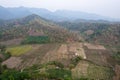 Drone shot aerial view scenic landscape of agriculture farm against mountain and nature forest