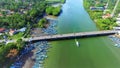 Drone shot of beautiful view of boats lining up a river in Jakarta.