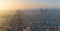 Drone shot of buildings and asphalt roads on Palm Jumeirah island in Dubai, UAE