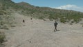 Drone shot of a Caucasian Man shooting with AR-15 SBR Rifle in Arizona Desert shoot range