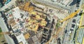 Construction site in town center top-down shot. Buildings, cars, streeets Royalty Free Stock Photo