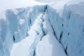 a drone shot of a glaciers crevasses filled with meltwater