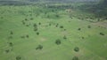 drone shot of gorgeous views across green rice fields surrounded by hills