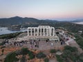 Drone shot of a group of people near the Temple of Poseidon at Sounion, Greece