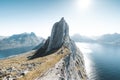 Drone shot of a huge rocky hill on the coast under the sunny sky Royalty Free Stock Photo