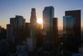 Drone shot of Los Angeles skyline silhouette during sunset