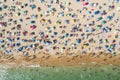 Drone shot of many people enjoying the beach and the ocean in high season- vacation pattern Royalty Free Stock Photo