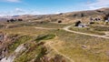 Drone shot of narrow paths and houses on a rock near Goat Rock Beach in Jenner, California, USA