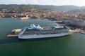 Drone shot of the nautical and a cruise ship MSC Fantasia anchored in seaport Trieste, Italy Royalty Free Stock Photo