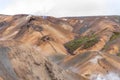 Drone shot of people walking on trail over Kerlingarfjoll mountain of Hveradalir hot springs