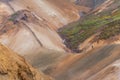 Drone shot of person walking on trail over Kerlingarfjoll mountain of Hveradalir hot springs