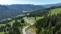 Drone shot of Riedberg pass with motorcyclist in Allgu Alps Royalty Free Stock Photo