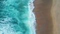 Drone shot turquoise sea waves washing empty tropical beach. Foamy ocean water. Royalty Free Stock Photo