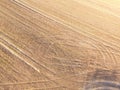 Aerial shot of tractor tracks in a field. Royalty Free Stock Photo