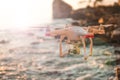 The drone in the sunset sky. ocean wave mountains Close up of quadrocopter outdoors. concept for film maker wedding videography