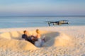 Drone taking footage and images of wedding couple at the beach