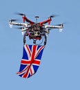 Drone uav flying the british union jack flag camera flight flying spying spy surveillance Royalty Free Stock Photo