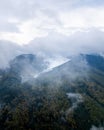 Drone vertical shot of fog over mountains during autumn