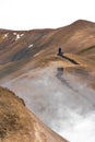 Drone vertical shot of person walking over Kerlingarfjoll mountain of Hveradalir hot springs