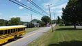Yellow School Bus Driving By
