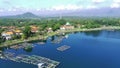 drone video of a scenic village nestled on the shores of a Ranu Pakis lake.