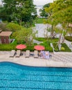 drone view from above at a couple swimming in an infinity pool on a luxury vacation in Thailand Royalty Free Stock Photo