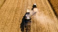 Drone view of agriculture machinery working the fields