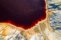 drone view of an alien landscape with a red lake. landscape similar to space to another planet