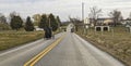 Drone View of an Amish Horse and Buggy Traveling Along a Country Road on a Summer Day Royalty Free Stock Photo