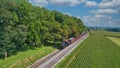 Drone View of an Antique Steam Engine, Approaching, Blowing Steam and Traveling Along Royalty Free Stock Photo