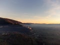 Drone view of Assisi Umbria Italy above mist at sunset