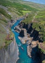 drone view of the basalt columns Jokla River in Studlagil Canyon with a viewing platform and tourists in the foreground Royalty Free Stock Photo