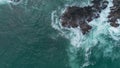 Drone view of the beauty of the coral rocks and the calm waves of the sea on the coast Royalty Free Stock Photo