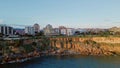 Drone view building complex summer seascape. Coastal resort town located cliff