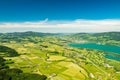 Aerial view on colorful small agricultural parcel fields near Mondsee lake, Vocklabruck, Austria